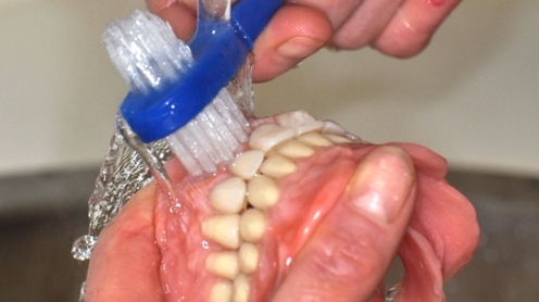 Clean your new dentures daily to keep them in tip top condition